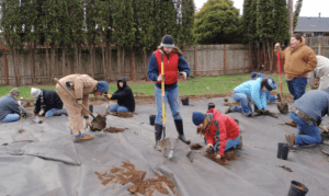 Volunteers building the demonstration garden.